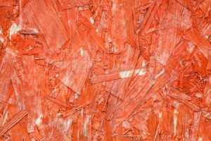 Particle board painted redish-Orange.