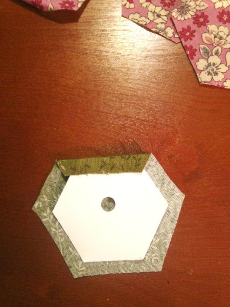 English Paper Pieced Hexagons - fold the seam allowance over and stick down