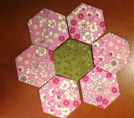 English Paper Pieced Hexagons - arranging the petals around the center hexagon