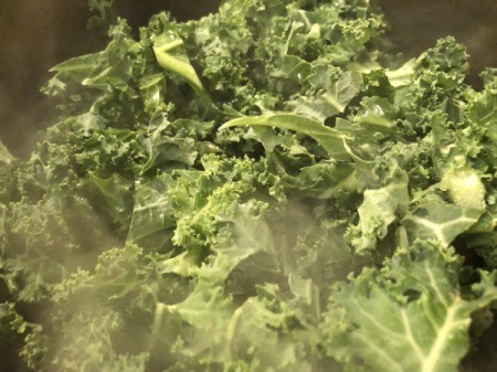 Kale added to pan