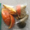 A ziplock baggie of citrus peels for use in the garbage disposal.