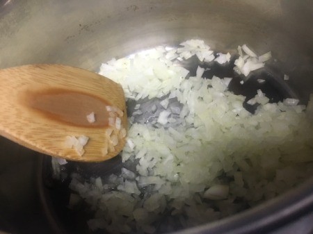 adding onions to pan