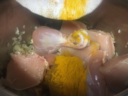 chicken added to pan with spice