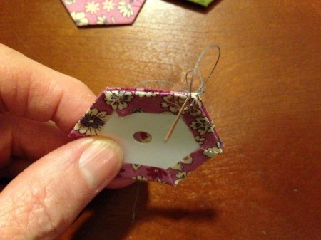 English Paper Pieced Hexagons - place right sides together and carefully stitch the pieces together, take small close together stitches