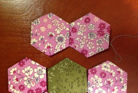 English Paper Pieced Hexagons - first two hexagons stitched and opened out