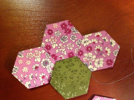 English Paper Pieced Hexagons - stitch third petal to center