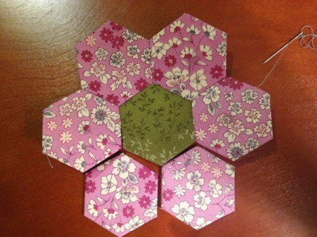 English Paper Pieced Hexagons - 4th petal stitched on