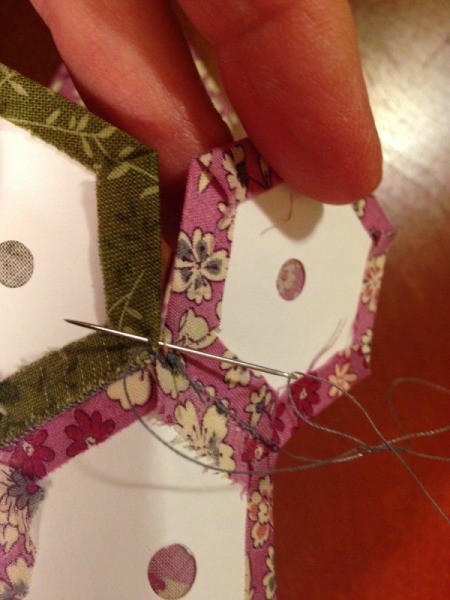 English Paper Pieced Hexagons - closeup of sewing petal to center