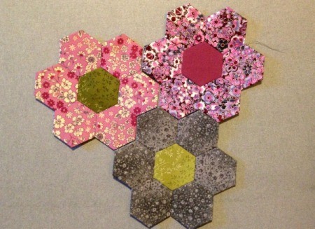 English Paper Pieced Hexagons - 3 hexagons in sample layout with gray flower in the center