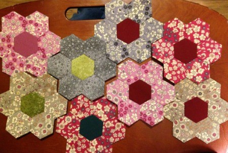 English Paper Pieced Hexagons - playing with layout of 8 blocks of varying colors