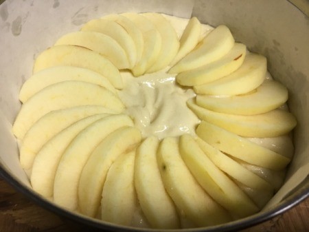 adding apples on top of batter