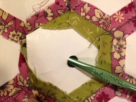 English Paper Pieced Hexagons - using a crochet hook to remove hexagon template only when there are pieces stitched on all sides