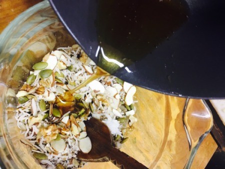 adding oil and honey to dry ingredients