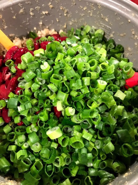 mixing salad ingredients