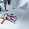 Sewing machine Embroidery of tree with pink and blue leaves