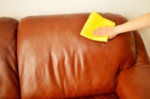 Cleaning leather chair with cloth