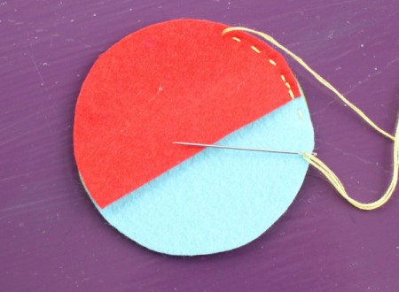 Felt Ear Bud Pod - sew them together using a running stitch, reinforce at the overlap, sew half way around