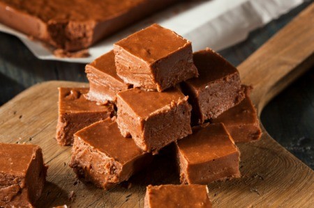 A pile of chocolate fudge squares.