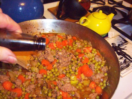 adding Worcestershire sauce to skillet