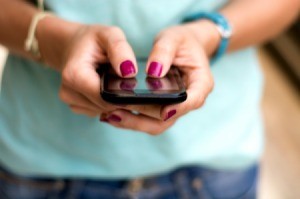 Woman texting after hiding