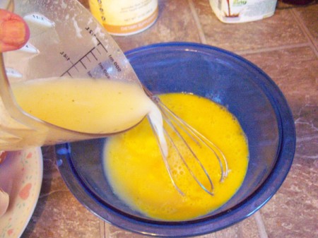 adding corn starch broth to eggs