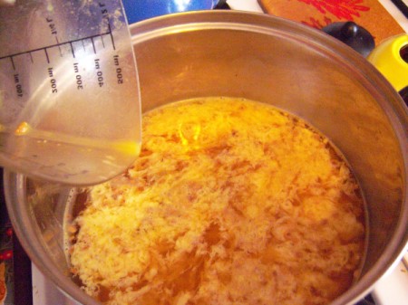 poured eggs cooking in ribbons in soup