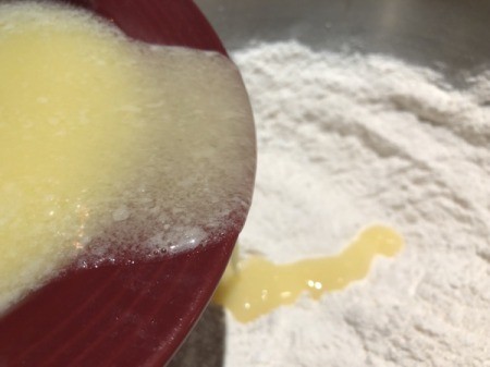 adding butter to flour