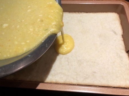 pouring batter in pan