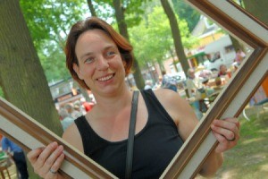 Woman holding picture frame she has purchased