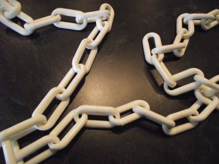 White plastic chain for using in the closet.
