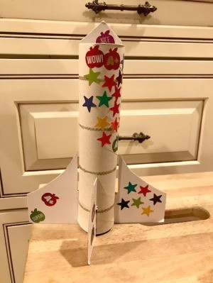 Paper Towel Roll Rocket Craft for Kids - larger rocket decorated with stickers