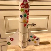 Paper Towel Roll Rocket Craft for Kids - larger rocket decorated with stickers