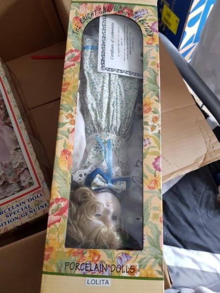 Value of a Knightsbridge Collection Porcelain Doll - doll upside down in the box