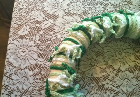 Yarn Chain St. Patty's Wreath - twisting the yarn to relocate the ties