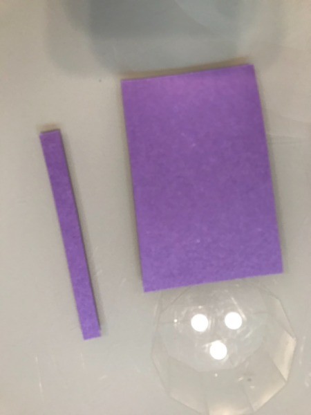 Paper Plate Bunny Mask - piece of purple paper with one strip cut