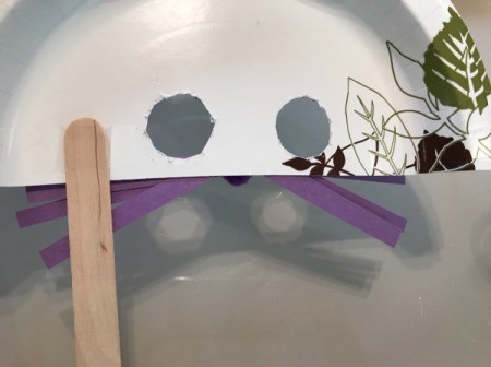 Paper Plate Bunny Mask - glue Popsicle stick in place on back side of the plate