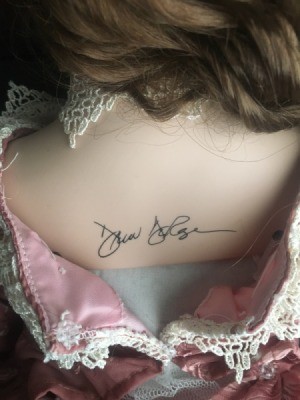 Identifying a Porcelain Dollmaker - signature on a doll's neck