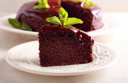 Slice of moist chocolate cake.