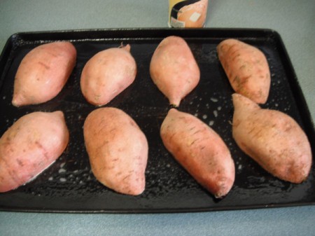 Sweet Potato Halves cut side down on baking sheet