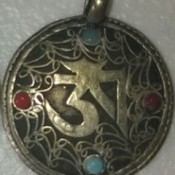 Identifying a Piece of Jewelry - dark silvertone pendant with colored stones and decorative filigree
