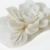 Flower carved into a bar of soap.