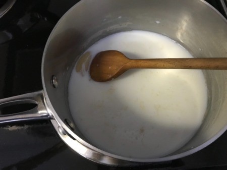 adding milk to flour and butter