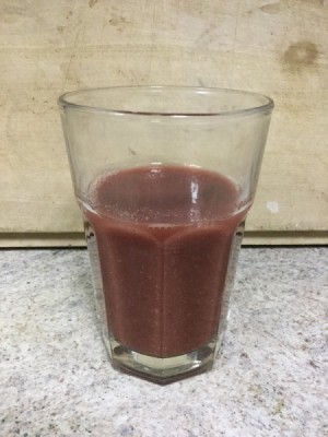 A glass of potato and beet juice.