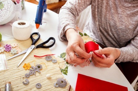 Woman crafting at her craft table