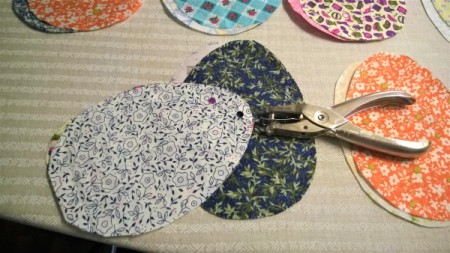 Flat and Fancy Hanging Egg Decorations - holding the two layers together punch a hole near the top