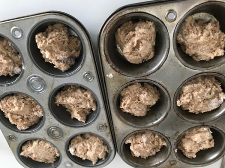 Applesauce Muffin batter in baking tins