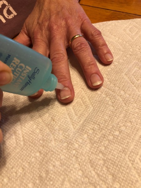 DIY Manicure - applying cuticle remover
