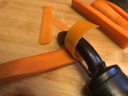 making thin carrot strips with peeler