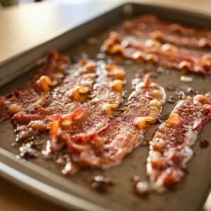 Bacon on a stone cookie sheet.