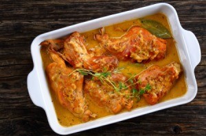 Mustard rabbit in a baking dish.